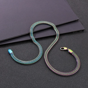 Detail of rainbow gradient flat snake chain necklace with lobster clasp in macro view