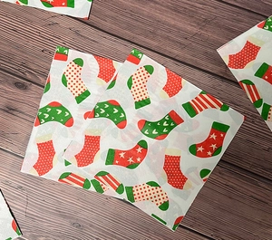 Detailed pattern of festive Christmas stockings printed on soft wood pulp paper napkins