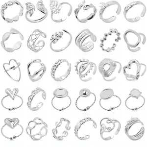 Detailed grid of thirty adjustable silver-colored rings with various patterns and styles