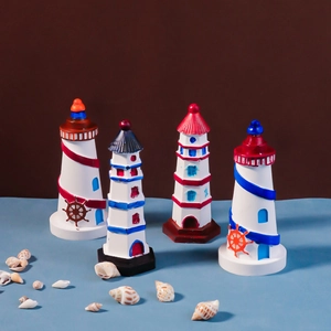 Detail of four Mediterranean style lighthouse figurines with shells and coastal motifs
