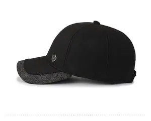 Side view of winter warm baseball cap showing thick black fabric and metal shield badge