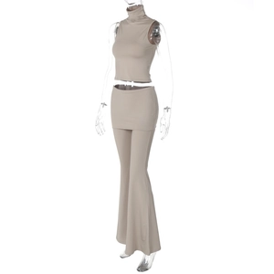 Detailed view of apricot three-piece set with sleeveless top, mini skirt, and flared pants