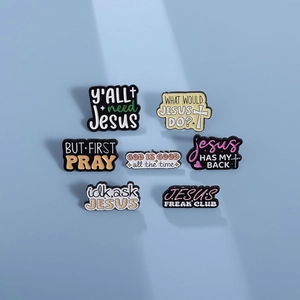 Religious enamel pins set with Christian slogans on a light blue background