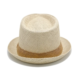 Close-up of woven straw fedora featuring a fine texture and brown decorative band detail