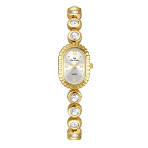 Detail of gold oval watch with crystal-encrusted metal band and Roman numerals