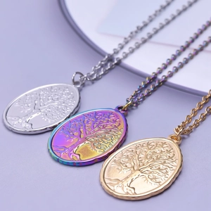 Macro shot of colorful stainless steel tree of life oval pendants on necklace chains