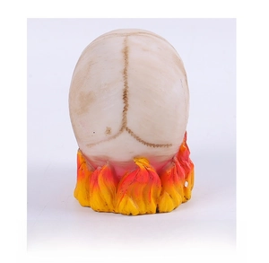 Detailed back view of a resin skull ornament with flame patterns and bone textures