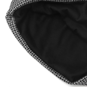 Detail of black and white geometric knit texture with soft black fabric lining