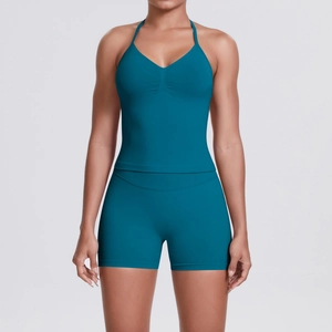 Front view of peacock blue yoga set featuring a halter V-neck top and high waist shorts