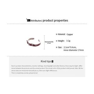 Detail view of silver finish copper bow ring with red coating and size dimensions