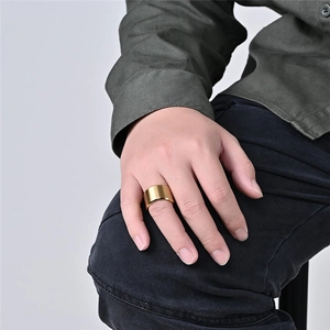Macro shot of 10mm matte brushed gold titanium steel ring for a minimalist punk look