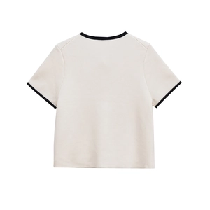 Chic cream short sleeve knit top with black contrast trim on the back view