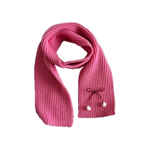 Pink knitted bow scarf for women and girls with cute pompom trim on white background