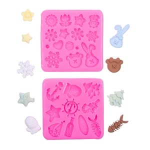 Pink silicone mold set featuring Christmas tree snowflakes and cute animal shapes for DIY crafts