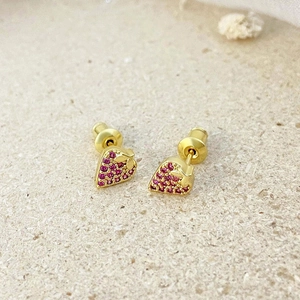 Elegant 18k gold plated strawberry stud earrings with red cubic zirconia on beige surface
