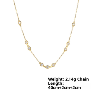 Detail of 925 silver gold chain showing round bezel-set cubic zirconia stones and 40cm length