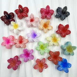 Set of 18 colorful gradient plumeria flower hair claws for trendy vacation styling