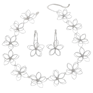 Detailed view of silver hollow flower necklace and earrings set with intricate weaving