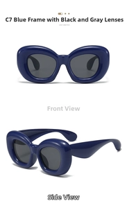 Detail view of bold blue puffer frame sunglasses with dark grey lenses and chunky temple