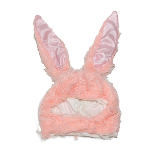 Detail of pink plush rabbit ear hat showing fluffy texture and silky satin lining