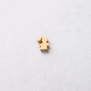 Macro view of gold female silhouette pendant charm in mirror-polished stainless steel