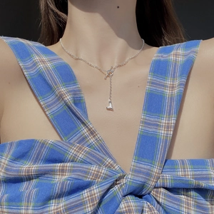 Detail of silver S925 heart pendant necklace with OT toggle clasp on a model's neck