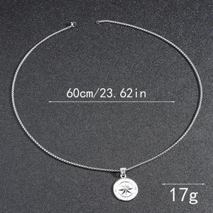 Detailed view of silver compass pendant on box chain with 60cm length and 17g weight specs
