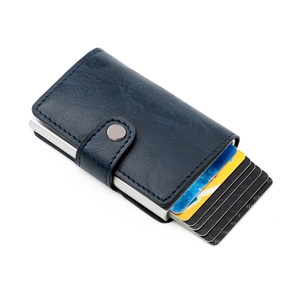 Detail of blue leather RFID blocking slim wallet with silver aluminum pop-up card holder