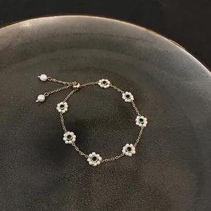 French vintage emerald flower bracelet with adjustable gold chain and pearl petals