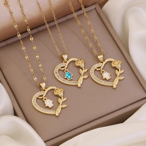 Gold-plated heart pendant necklaces with roses and Hamsa hand in opal and rhinestones