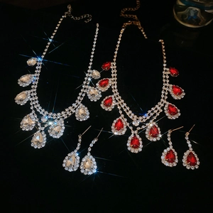 Sparkling waterdrop tassel necklace and earrings set in silver and gold luxury finishes