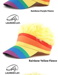 Detail of two rainbow striped visor hats with vibrant fuzzy wig top for parties