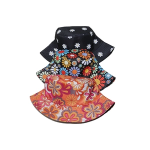 Detailed stack of floral bucket hats featuring daisy prints and vintage flower patterns