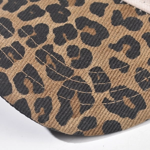 Close-up of leopard print cotton baseball cap with five rows of reinforced stitching