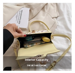 Detail view of the cherry print handbag showing the spacious interior storage capacity
