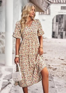 Close-up of floral V-neck short sleeve tiered dress with red and blue flower prints