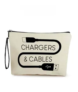 Detail view of cream canvas cable organizer bag with black metal zipper and wrist strap