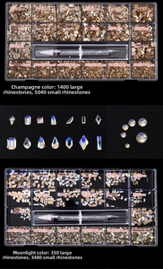 Detailed view of 21-grid nail art rhinestones kit with various shapes and picker tool