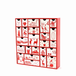 Detailed view of red wooden Christmas advent calendar with 24 white numbered DIY gift drawers