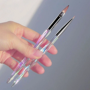 Detail of hand-held iridescent acrylic nail brushes for precision lining and painting