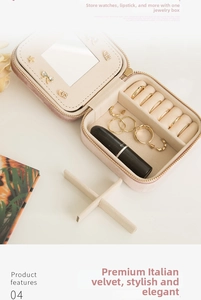Pink velvet travel jewelry box with mirror, storage slots for rings and earrings