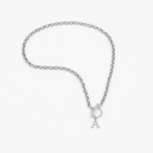Minimalist silver toggle clasp necklace featuring a delicate chain and letter A pendant
