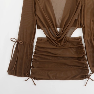 Detail of dark brown mesh long sleeve top and drawstring mini skirt with draped neckline