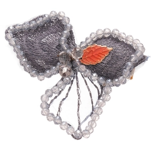 Vintage silver fabric bow hair clip with grey beads and an orange enamel leaf detail