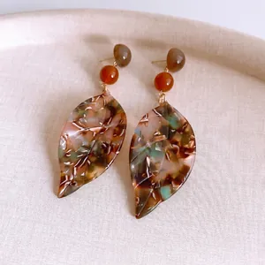 Vintage acetate leaf earrings with tortoiseshell pattern and golden metal accents