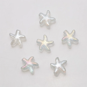 Macro shot of six transparent holographic starfish charms for DIY jewelry making