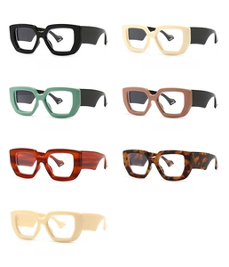 Flat lay of vintage square thick frame glasses in seven assorted fashion colors