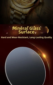 Detailed close-up of the mineral glass crystal on a luxury gold men's quartz watch