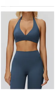 Close-up of halter neck yoga bra and high-waist leggings in premium grey blue fabric