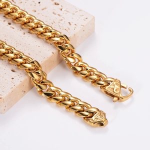 Chunky gold stainless steel Cuban link necklace with vintage embossed clasp on stone